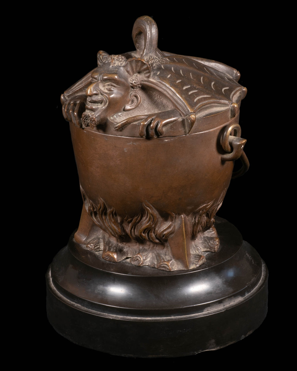 bronze forming a covered pot a devil in a cauldron - RELICS