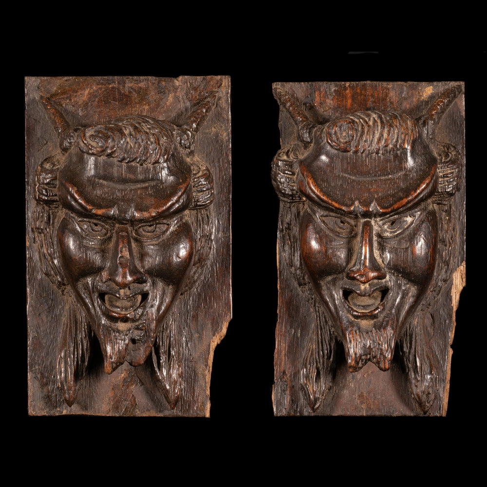 PAIR OF CARVED DEVIL FACES - RELICS