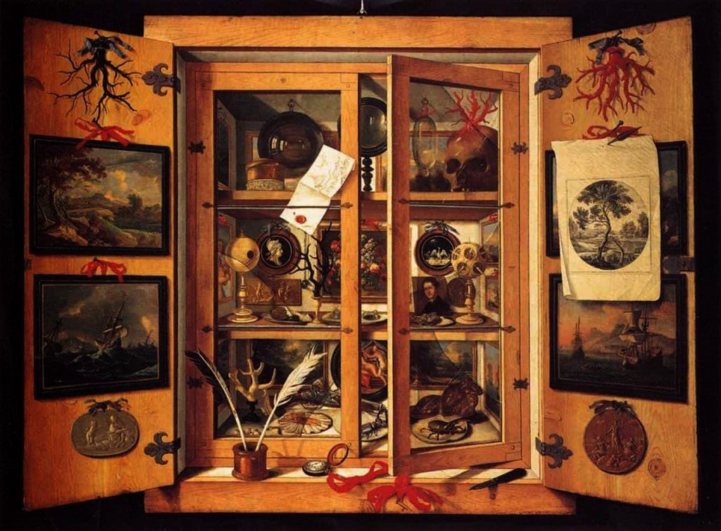 Historic cabinet of curiosities displaying religious artifacts, relics and rare antiquities.